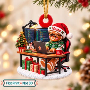 May include: A Christmas ornament featuring a gingerbread person wearing a Santa hat with the text Name, glasses, and a green sweater, sitting at a desk with two computer monitors, a laptop, a small tree, and gifts. Text reads Flat Print Not 3D.