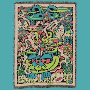 May include: A woven tapestry featuring a colorful, psychedelic design with a large cat face in the center. The design includes various animals, plants, and abstract shapes in shades of green, blue, pink, and yellow. The text "NO DOGS ALLOWED" is visible at the bottom of the tapestry.