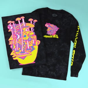 May include: Black long-sleeve shirt and poster with a colorful graphic design. The shirt features a design on the chest and sleeve, with the words "Killer Acid" in yellow. The poster has a similar design with a face and mushroom-like shapes.