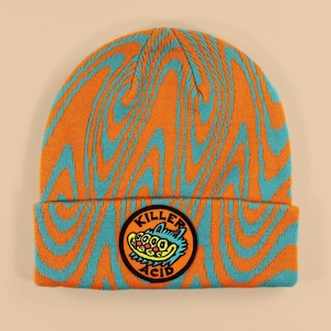 May include: Orange and blue knit beanie with a circular patch that says "Killer Acid" and features a cartoon monster with a toothy grin.