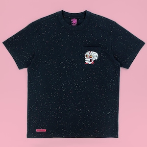 May include: A black short-sleeve t-shirt with a speckled pattern in white, red, and blue. The shirt features a chest pocket with a white skull graphic, a pink brand tag at the bottom hem, and a black inner neck label with pink text.