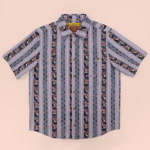 May include: A short-sleeve button-down shirt featuring a repeating pattern of vertical stripes, zigzag lines, and small mushroom illustrations. The shirt is primarily grey, black, and pink, with a collar, a front button placket, and a small label.