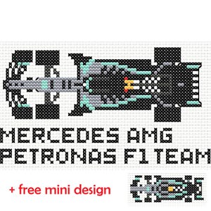 May include: Cross-stitch design of a Formula 1 race car in black, grey, and teal. The text "MERCEDES AMG PETRONAS F1 TEAM" is below the car. Includes a small, free mini design.
