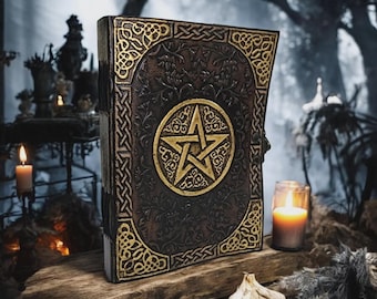 May include: A large, antique-style book with a dark brown cover and gold accents. The cover features a gold pentagram in a circle and ornate Celtic knotwork. The book is displayed on a wooden surface with candles and a mystical atmosphere.