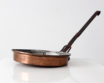 antique copper saute pan with forged iron handle