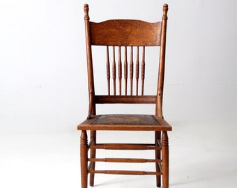 antique press back chair with leather seat