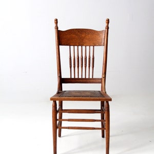 antique press back chair with leather seat