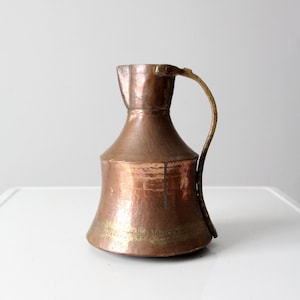 antique hammered copper pitcher