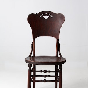 antique bentwood chair with cutout back