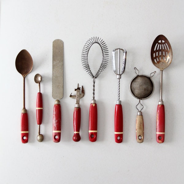 vintage kitchen utensil collection, red wood handle utensils