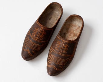 antique carved wooden clogs, decorative wood shoes