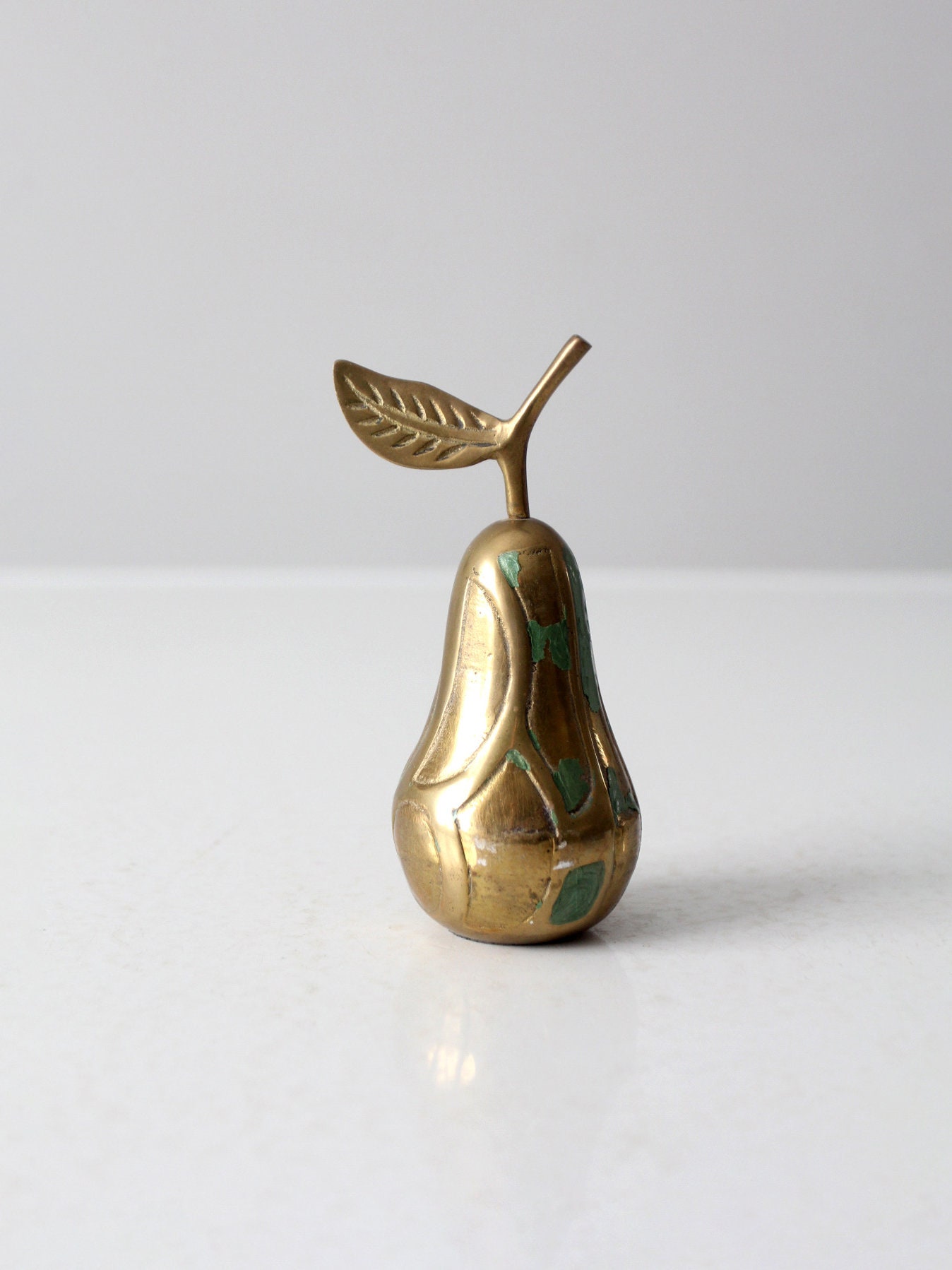 mid-century brass pear paperweight