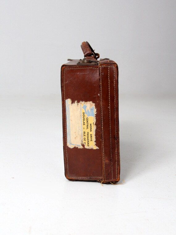antique leather suitcase with travel stickers - image 4