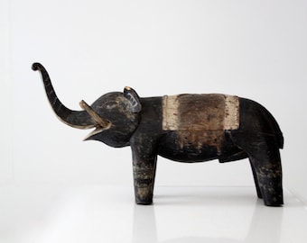 antique carved wood elephant, wooden statue