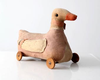 antique toy duck, stuffed animal pull toy