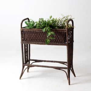 antique woven wicker planter stand