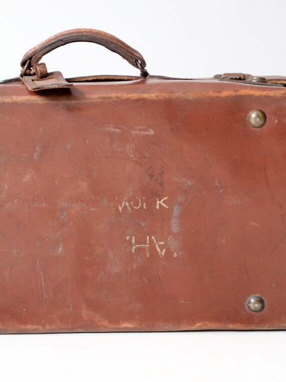 antique leather suitcase with travel stickers - image 10