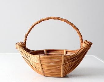 vintage rattan boat shaped basket