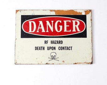 vintage metal Danger sign mounted on wood