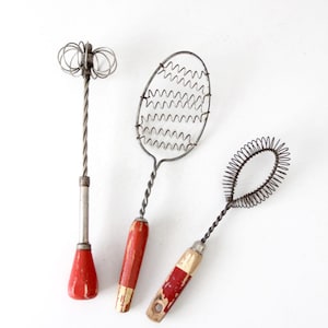 vintage red-handled whisk collection