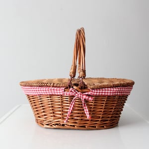 vintage wicker picnic basket with gingham lining