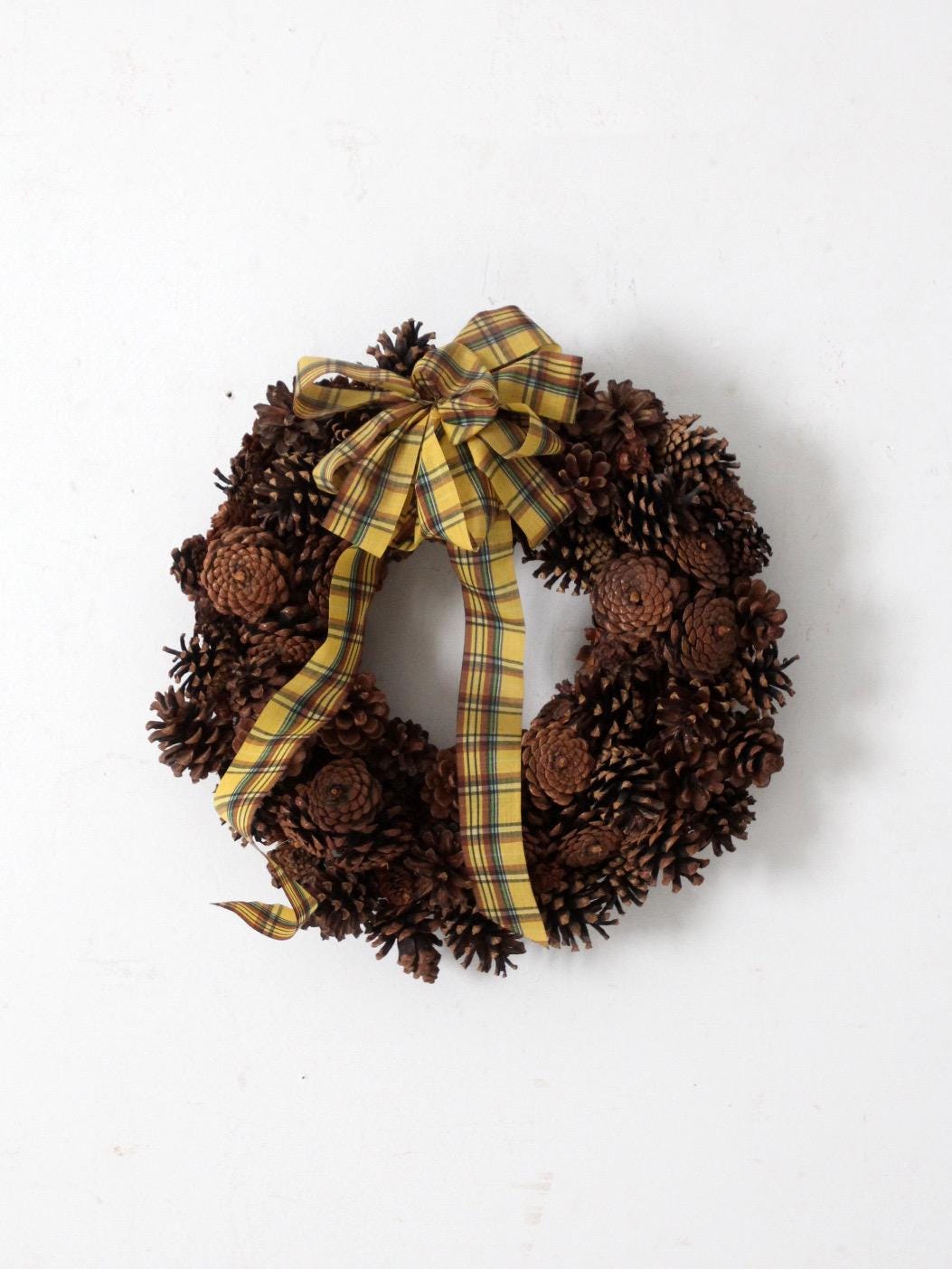 21 Winter Wreath Ideas Beyond Christmas 7 vintage pine cone wreath with tartan ribbon
