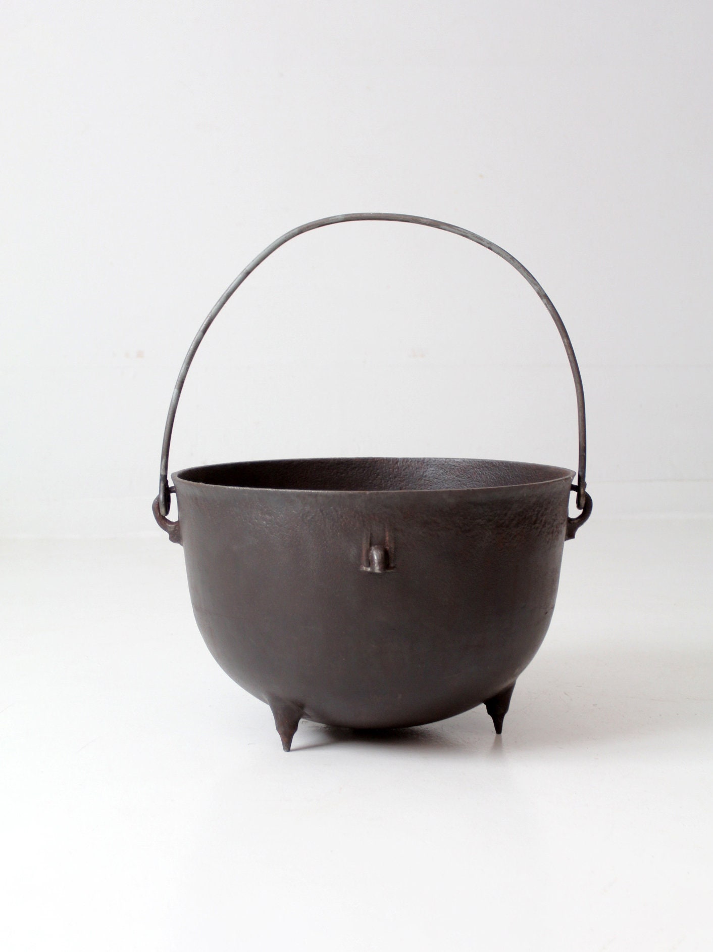 Beautiful antique cast iron cauldron example
