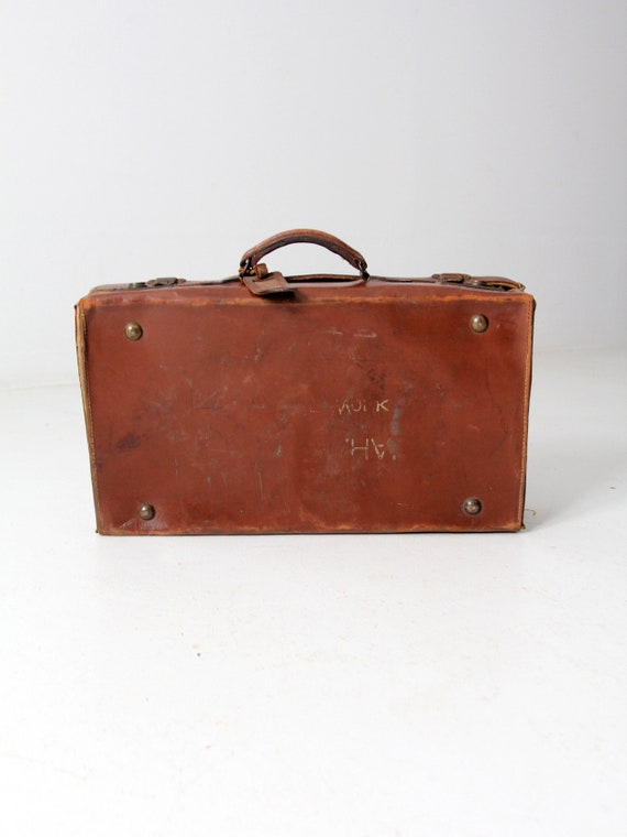 antique leather suitcase with travel stickers - image 9