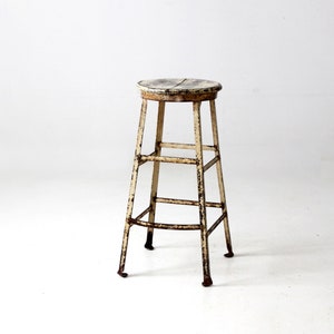 vintage industrial stool with wood seat
