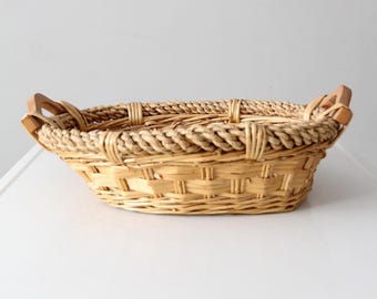 vintage wicker catchall basket with wooden handles