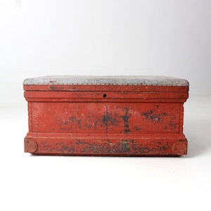 antique red wooden chest with galvanized top