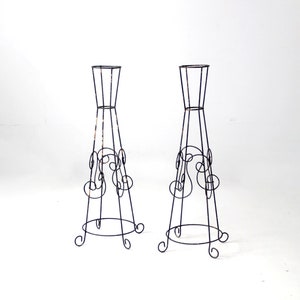 mid-century iron plant stands pair
