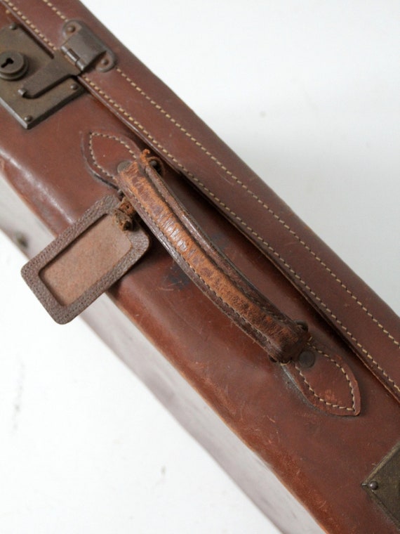 antique leather suitcase with travel stickers - image 6