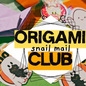 May include: An image featuring origami, stickers, and the text "Origami Snail Mail Club." The origami is in orange and purple. Stickers include a black cat, a chef, and a pink cowgirl. The background is green.