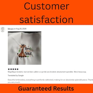 May include: A white fabric square featuring a machine-embroidered design of a brown giraffe with spots, surrounded by small green leaves and the text Born to be Wild in brown and green lettering, centered on the fabric surface.