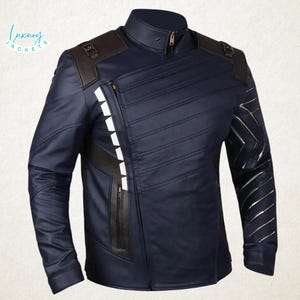 May include: A navy blue leather jacket with a stand-up collar and a diagonal zip. The jacket has brown shoulder accents, white accents on the zip, and silver chevron detailing on the sleeves. The text "Luxury Jackets" is in the upper left corner.