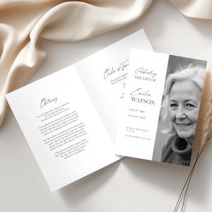 May include: A set of white memorial cards, including an obituary and order of service. The right-hand card displays a black and white photograph of a smiling woman. Text includes the name "Emilia Watson" and dates.