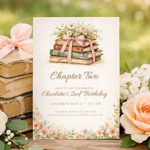May include: An invitation card with watercolor illustrations. The card features a stack of books tied with a pink ribbon, topped with flowers. Text reads "Chapter Two" and announces Charlotte's 2nd birthday, with date, time, and location details.