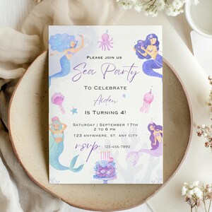May include: A mermaid-themed invitation with the text "Sea Party" and "To Celebrate Aiden Is Turning 4!" in purple script. The invitation features watercolor illustrations of mermaids, an octopus, and a cake. The event details are also included.