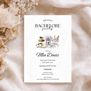 May include: White invitation card with the text "Join us for a BACHELORE party" and "In honour of Mia Davis". The card includes an illustration of food and drinks. The invitation is for a party with refreshing drinks and great music.