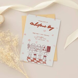 May include: A Valentine's Day invitation with a bar illustration, featuring the text "Please Join Us Valentine's Day". The invitation is on a cream-coloured background with pink hearts and a gold envelope.