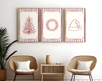 Puede incluir: Tres láminas enmarcadas con temática navideña. Cada lámina presenta un dibujo lineal rojo sobre un fondo crema, con un borde a rayas rojas y blancas. Las láminas representan un árbol de Navidad, una corona y un gorro de Papá Noel.