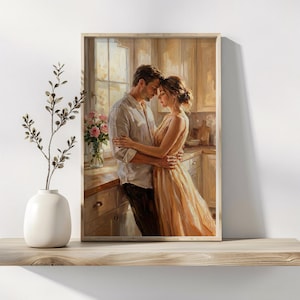 May include: A framed art print shows a couple embracing in a kitchen. The woman is in a peach-coloured dress, the man in a white shirt and dark trousers. The scene is bathed in soft light, with a vase of pink roses adding to the romantic atmosphere.