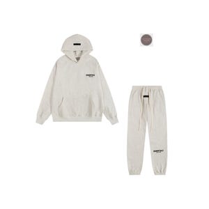 May include: A light gray hoodie and matching sweatpants set. The hoodie has a front pocket and a small logo on the chest. The sweatpants have a drawstring waist and a logo on the lower leg. The set is made of a soft, comfortable material.