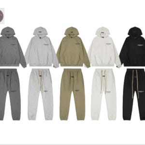 May include: Five matching hoodie and sweatpants sets in various colors: gray, light gray, olive green, white, and black. Each set features a hooded sweatshirt and matching sweatpants with a drawstring waist.