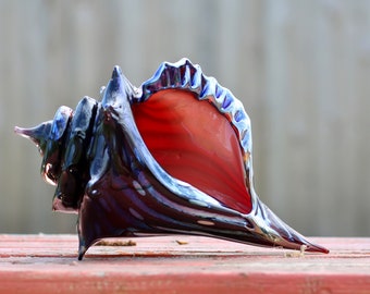 Deep red conch shell, blown glass