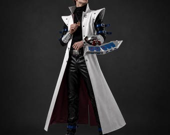 May include: A long white coat with a high collar, worn over a black turtleneck and black trousers. The coat features silver buttons, blue buckled straps on the sleeves, and a dark red lining. A silver mechanical gauntlet is attached to the left arm.