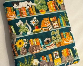 Kindle Paperwhite books and cats on shelves//zippered kindle sleeve. Small Paperback book holder