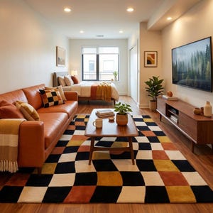 May include: A modern living room with a brown leather sofa, a checkered rug in black, white, orange, and yellow, and a wooden coffee table. A bed is visible in the background, along with a TV and a wooden media console.