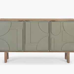 May include: A contemporary three-door cabinet with a pale green finish and geometric patterns on the doors. It features a natural wood top and base, supported by four wooden legs. This stylish storage unit is suitable for any living space.